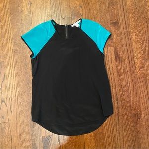 Diane von Furstenberg black top with turquoise